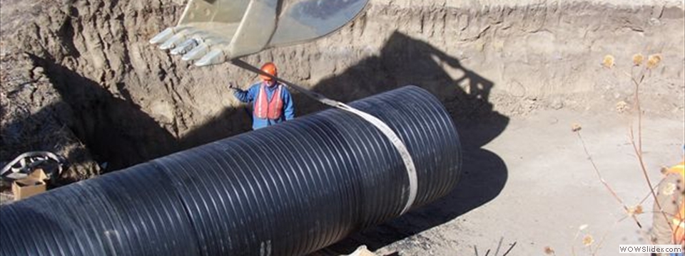 Crews positioning helical-spiral HDPE